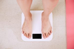 Photo of a person's feet on body mass scale