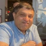 Dipesh, Arthritis Action member smiling for the camera